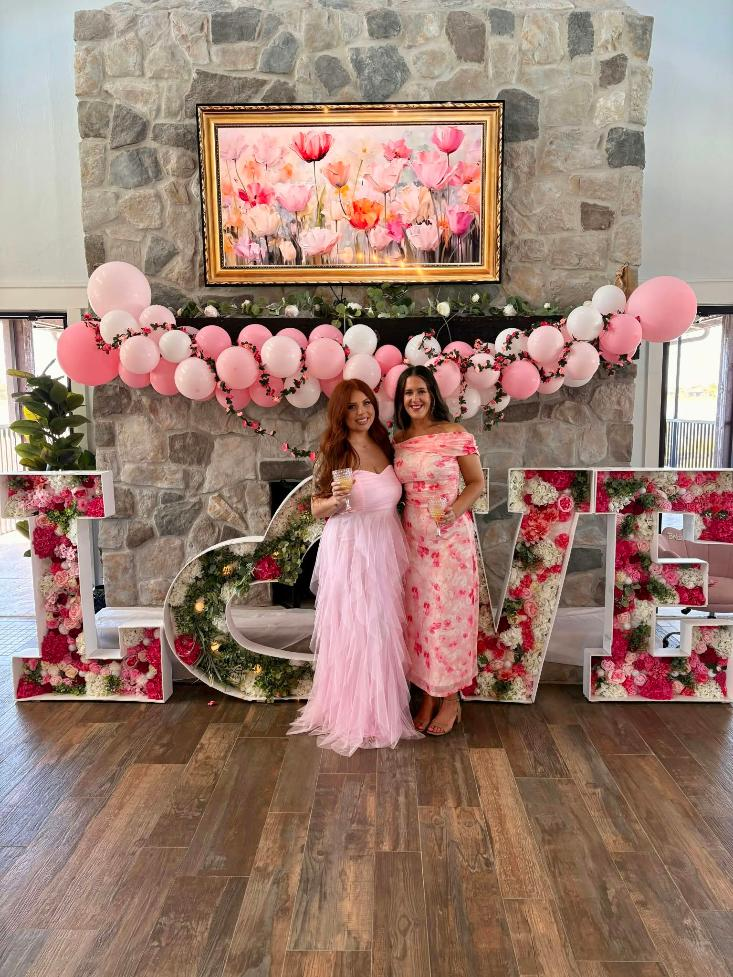 Pink Floral arrangements and decorative event setup for a special celerbration