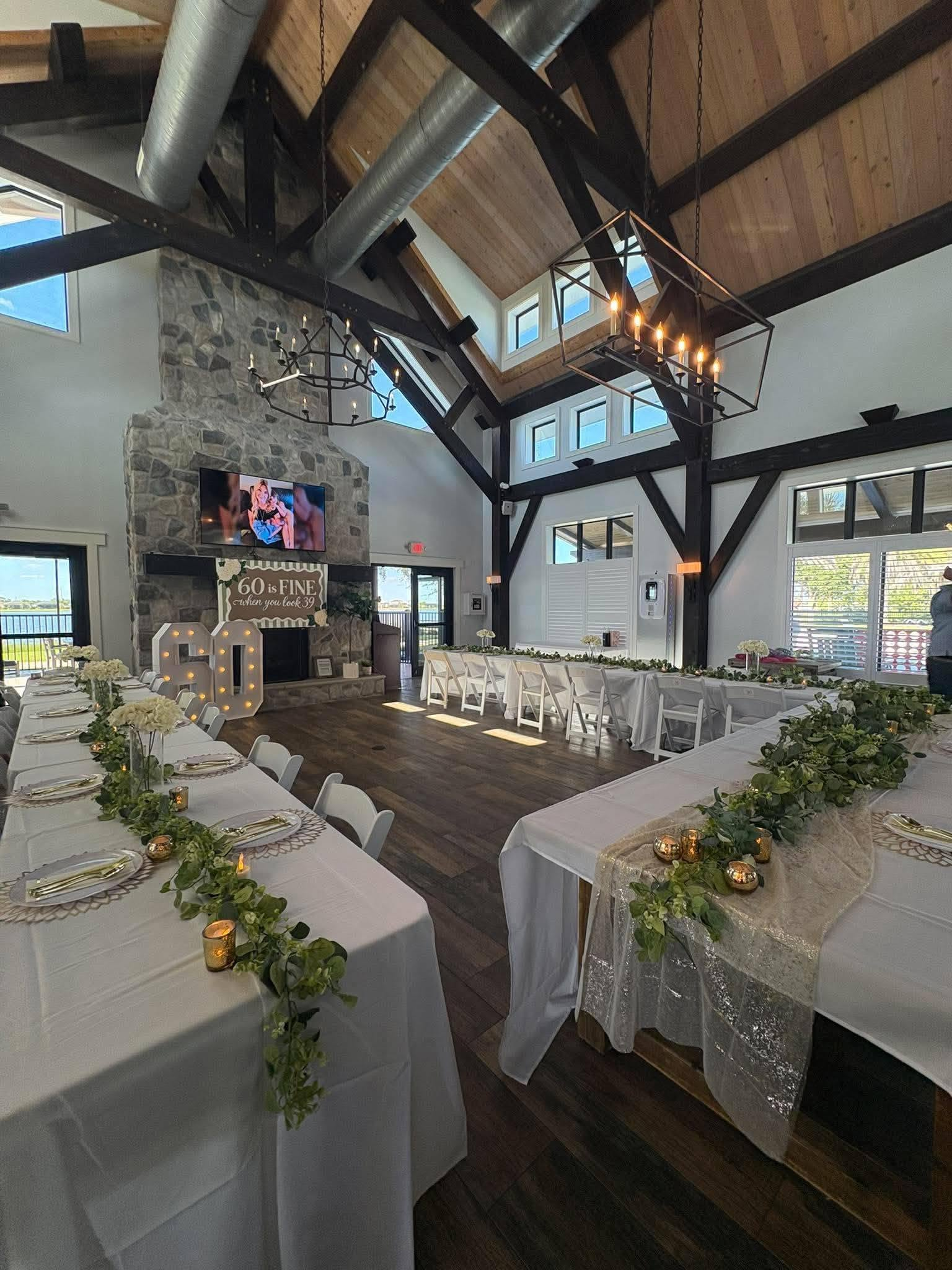 Indoor celebration venue with decorated tables arranged for a private party or special occasion.