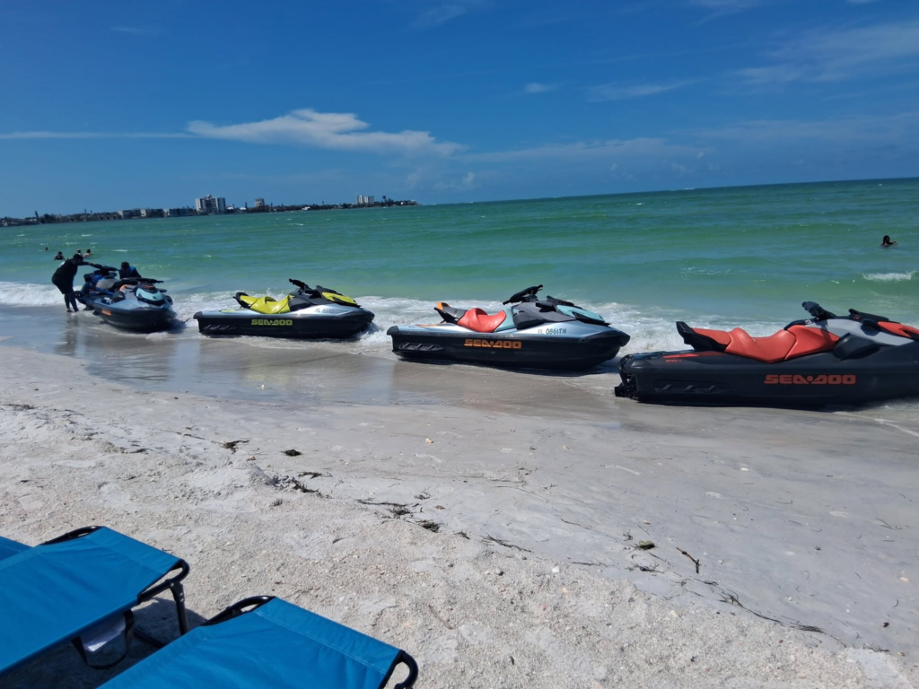 Four jet skis lined up for a coastal corporate event in Sarasota.