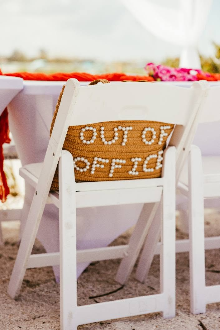 Coorprate beach event on Florida's Gulf Coast, Chair with pillow saying out of office 